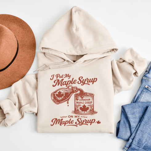 Funny maple syrup hoodie that says “I Put My Maple Syrup On My Maple Syrup” Canadian humor hoodie with vintage maple syrup graphic.