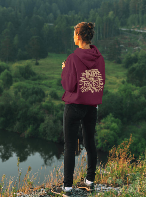 Featuring the phrase "Into the Forest" uniquely crafted in tree branch lettering, this design brings the beauty and mystery of the woods to life.