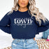 Small Town Hockey Mom sweatshirt with white typography design on a cozy white crewneck, perfect for rink moms and hockey season apparel