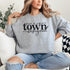 Small Town Hockey Mom sweatshirt with black typography design on a cozy white crewneck, perfect for rink moms and hockey season apparel