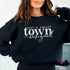 Small Town Hockey Mom sweatshirt with white typography design on a cozy white crewneck, perfect for rink moms and hockey season apparel