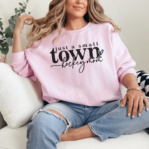 Small Town Hockey Mom sweatshirt with black typography design on a cozy white crewneck, perfect for rink moms and hockey season apparel