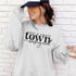 Small Town Hockey Mom sweatshirt with black typography design on a cozy white crewneck, perfect for rink moms and hockey season apparel