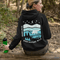 This hoodie features a silhouetted polar bear wandering across layered frozen prairie hills, this design captures the quiet majesty of nature.