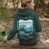 This hoodie features a silhouetted polar bear wandering across layered frozen prairie hills, this design captures the quiet majesty of nature.