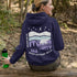Featuring a sleek polar bear silhouette wandering through layered frozen prairie hills, this hoodie design evokes the serenity of untouched nature.