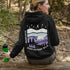 Featuring a sleek polar bear silhouette wandering through layered frozen prairie hills, this hoodie design evokes the serenity of untouched nature.