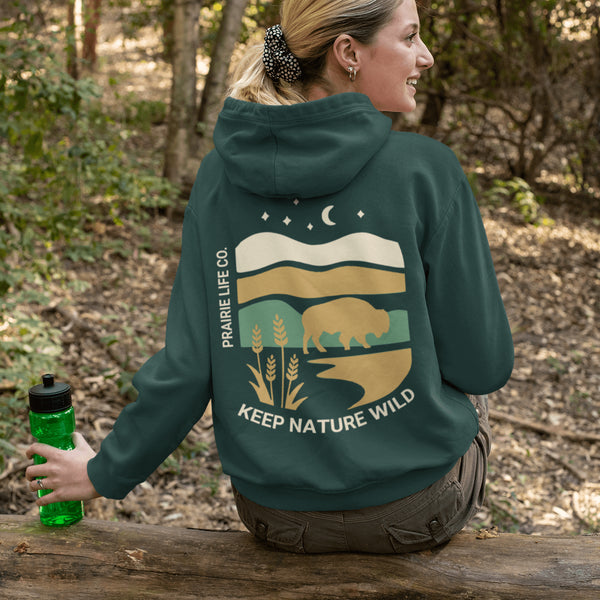 Celebrate the beauty of the prairies with this bold color-blocked hoodie featuring a striking bison silhouette, golden wheat fields, and an open prairie sky.