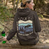 This hoodie features a moose silhouette roaming across prairie hills, pine trees with stars scattered above and a crescent moon glowing softly.