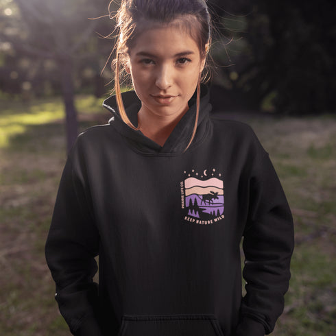 Inspired by Canada’s rugged landscapes and iconic wildlife, this design features a striking moose silhouette set beneath a starry sky and rolling wilderness.