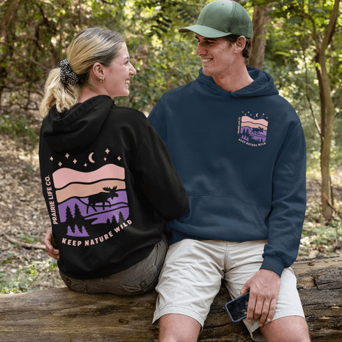 Inspired by Canada’s rugged landscapes and iconic wildlife, this design features a striking moose silhouette set beneath a starry sky and rolling wilderness.