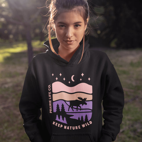 The Keep Nature Wild Hoodie features our signature moose and wilderness design, inspired by the landscapes that make the prairies and beyond so unforgettable.