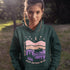 The Keep Nature Wild Hoodie features our signature moose and wilderness design, inspired by the landscapes that make the prairies and beyond so unforgettable.