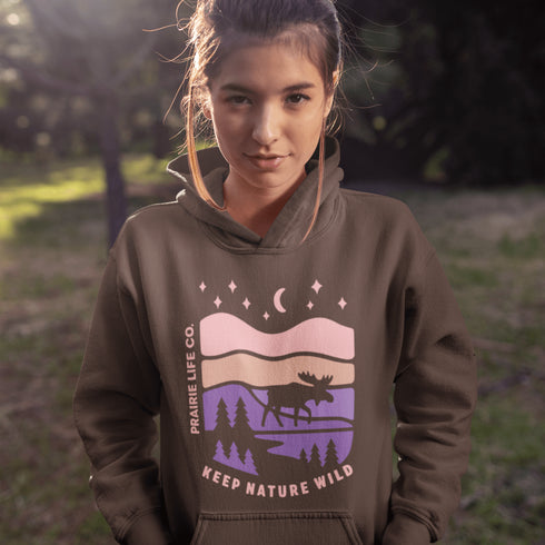 The Keep Nature Wild Hoodie features our signature moose and wilderness design, inspired by the landscapes that make the prairies and beyond so unforgettable.