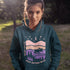 The Keep Nature Wild Hoodie features our signature moose and wilderness design, inspired by the landscapes that make the prairies and beyond so unforgettable.