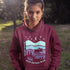Featuring a minimalist moose design inspired by Canada’s untamed landscapes, this hoodie captures the simple joy of being present in nature.