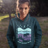 Featuring a minimalist moose design inspired by Canada’s untamed landscapes, this hoodie captures the simple joy of being present in nature.