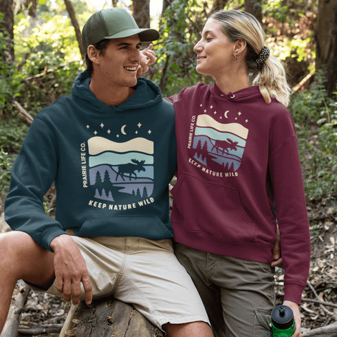 Featuring a moose design paired with a nature-inspired landscape, this hoodie reflects the beauty of Canada’s wild spaces and the importance of protecting them.
