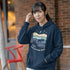 Featuring a moose design paired with a nature-inspired landscape, this hoodie reflects the beauty of Canada’s wild spaces and the importance of protecting them.