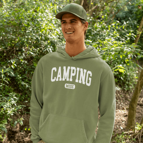 Introducing the ultimate must-have for every outdoor enthusiast who secretly wishes they could bring a slice of home comfort to the wilderness: the "Camping Mode" Hoodie.