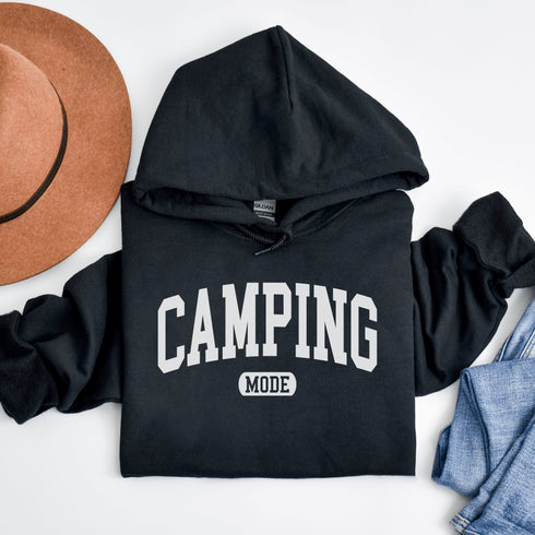 Introducing the ultimate must-have for every outdoor enthusiast who secretly wishes they could bring a slice of home comfort to the wilderness: the "Camping Mode" Hoodie.