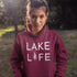 Embrace the serene vibes of lakeside living with our exclusive "Lake Life" hoodie. Designed for those who find their peace by the water, this hoodie combines comfort with a statement of tranquility.
