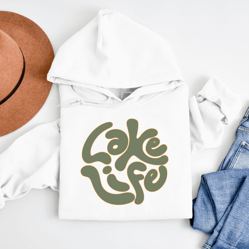 Embrace the serene vibe of lakeside living with our "Lake Life" Hoodie, a perfect blend of comfort and nostalgia. Crafted with a nod to the laid-back, timeless appeal of lake life, this hoodie features the phrase "Lake Life" prominently displayed in a charming retro font that evokes memories of sunny days spent by the water, laughter-filled evenings around campfires, and the soothing tranquility of nature.