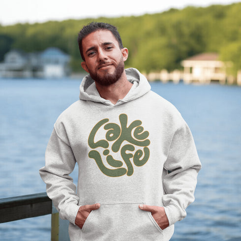Embrace the serene vibe of lakeside living with our "Lake Life" Hoodie, a perfect blend of comfort and nostalgia. Crafted with a nod to the laid-back, timeless appeal of lake life, this hoodie features the phrase "Lake Life" prominently displayed in a charming retro font that evokes memories of sunny days spent by the water, laughter-filled evenings around campfires, and the soothing tranquility of nature.