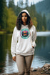 Ever wish you could bottle up the magic of a Whiteshell sunset without the threat of a mosquito swarm? Now you can! With this cozy hoodie featuring a stunning lake view from the heart of Manitoba’s Whiteshell, you’ll be wrapped in nature’s beauty while staying warm and bug-free.