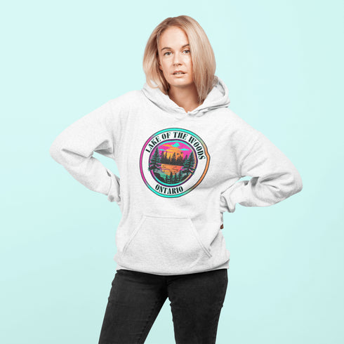 Featuring a stunning lake scene with a vibrant sunset, this hoodie captures the beauty of Lake of the Woods in Ontario, where tranquil waters meet the warm glow of a setting sun.