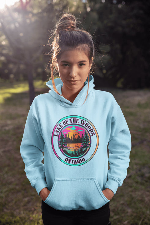 Featuring a stunning lake scene with a vibrant sunset, this hoodie captures the beauty of Lake of the Woods in Ontario, where tranquil waters meet the warm glow of a setting sun.