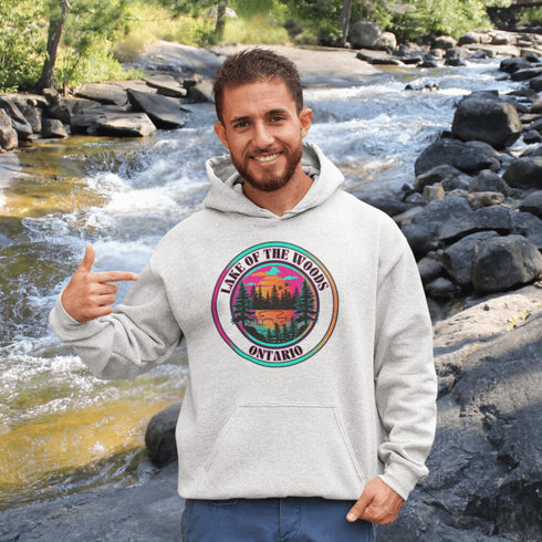 Featuring a stunning lake scene with a vibrant sunset, this hoodie captures the beauty of Lake of the Woods in Ontario, where tranquil waters meet the warm glow of a setting sun.