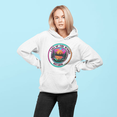Featuring a stunning lake scene with a vibrant sunset, this hoodie captures the beauty of Lake of the Woods in Ontario, where tranquil waters meet the warm glow of a setting sun.