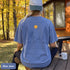 Comfort Colors 1717 unisex t-shirt featuring a coordinating left chest pocket design and large outdoor-inspired back graphic, shown in a lifestyle setting and available in multiple garment-dyed colours.