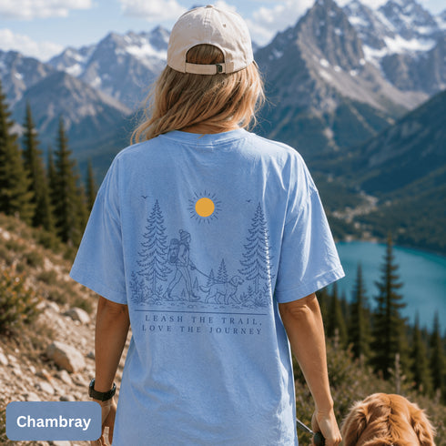 Comfort Colors 1717 unisex t-shirt featuring a coordinating left chest pocket design and large outdoor-inspired back graphic, shown in a lifestyle setting and available in multiple garment-dyed colours.