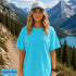Comfort Colors 1717 unisex t-shirt featuring a coordinating left chest pocket design and large outdoor-inspired back graphic, shown in a lifestyle setting and available in multiple garment-dyed colours.