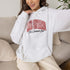 Lake Ontario Still Canadian Bud hoodie with red maple leaf collegiate lettering and Canadian lake-inspired design