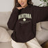 Manitoba Rooted in the Heartland hoodie with maple leaf and vintage collegiate lettering on a unisex Gildan sweatshirt