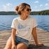 Livin' On Lake Time t-shirt featuring a lakeside chair and dock design inspired by Manitoba lake life and cottage weekends.