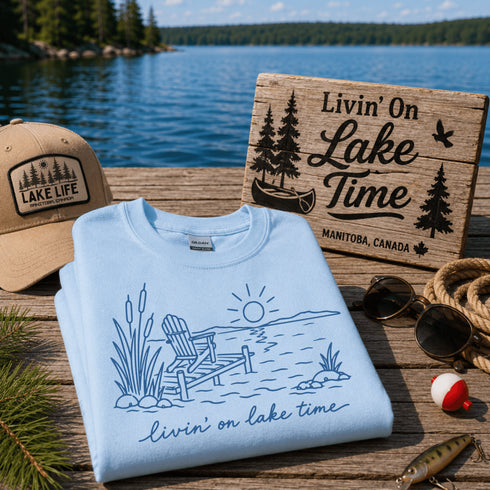Livin' On Lake Time t-shirt featuring a lakeside chair and dock design inspired by Manitoba lake life and cottage weekends.