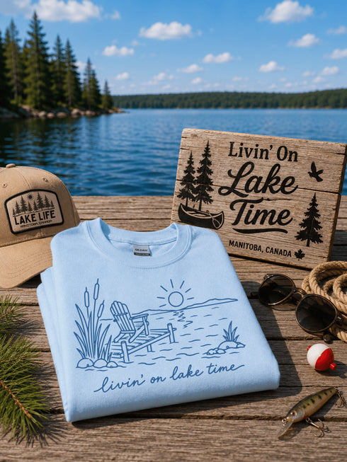 Livin' On Lake Time t-shirt featuring a lakeside chair and dock design inspired by Manitoba lake life and cottage weekends.