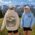 Vintage outdoor hoodie featuring a matching left chest graphic and a large back design inspired by hiking, forests, mountains, and adventure on a premium unisex hoodie displayed in an outdoor lifestyle setting.