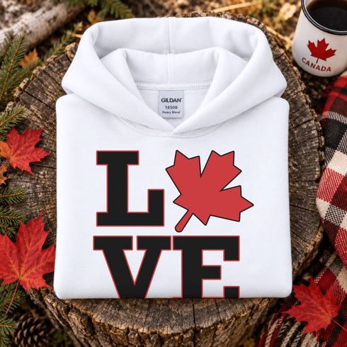Love Canada hoodie featuring bold black lettering and red Canadian maple leaf graphic on a unisex sweatshirt