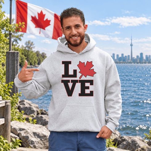 Love Canada hoodie featuring bold black lettering and red Canadian maple leaf graphic on a unisex sweatshirt