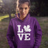 Canada LOVE hoodie with Canadian maple leaf graphic on a purple unisex sweatshirt