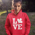 Canada LOVE hoodie with Canadian maple leaf graphic on a red unisex sweatshirt