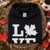 Canada LOVE hoodie with Canadian maple leaf graphic on a black unisex sweatshirt
