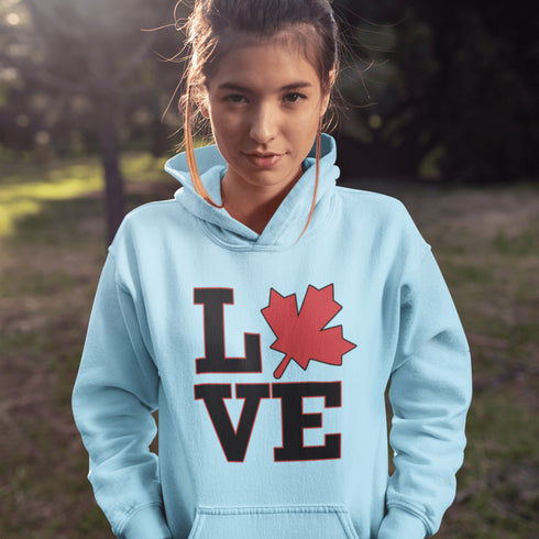 Love Canada hoodie featuring bold black lettering and red Canadian maple leaf graphic on a unisex sweatshirt