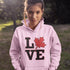 Love Canada hoodie featuring bold black lettering and red Canadian maple leaf graphic on a unisex sweatshirt