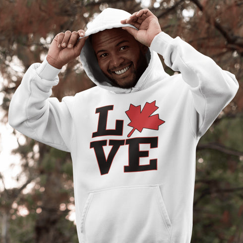 Love Canada hoodie featuring bold black lettering and red Canadian maple leaf graphic on a unisex sweatshirt